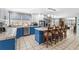 Spacious kitchen with tile flooring, kitchen island, stainless steel appliances, and white and blue cabinets at 138 Wofford Rd., Conway, SC 29526