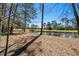 Picturesque view of a pond near a golf course, offering a serene and scenic backdrop to the property at 138 Wofford Rd., Conway, SC 29526