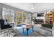 Comfortable living room with a fireplace, TV, ceiling fan, and doors leading to the outdoors at 138 Wofford Rd., Conway, SC 29526