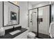 Stylish bathroom with modern fixtures, black-framed shower, and a sleek vanity at 1549 Casita Ln., Myrtle Beach, SC 29579