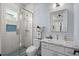 Bright bathroom with white vanity, shower, and blue accents at 1549 Casita Ln., Myrtle Beach, SC 29579