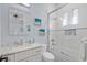 Well-lit bathroom featuring a tub and shower combination with tile surround and glass doors at 1549 Casita Ln., Myrtle Beach, SC 29579
