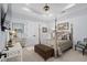 Cozy bedroom featuring a four-poster bed, soft lighting, and neutral tones at 1549 Casita Ln., Myrtle Beach, SC 29579