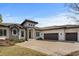 Beautiful home featuring a tile roof, brick driveway, and well-manicured front yard and landscaping at 1549 Casita Ln., Myrtle Beach, SC 29579