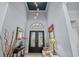 Grand foyer with a high ceiling, ornate lighting, and decorative accents creates a sophisticated entrance at 1549 Casita Ln., Myrtle Beach, SC 29579