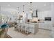 Bright, open kitchen with island, pendant lights, stainless appliances, and eat-in dining area at 1549 Casita Ln., Myrtle Beach, SC 29579
