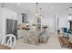 Spacious kitchen boasts an island with granite countertops, stainless steel appliances, and pendant lighting at 1549 Casita Ln., Myrtle Beach, SC 29579