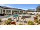 Relaxing backyard pool with a spa, outdoor seating, and a lushly landscaped patio at 1549 Casita Ln., Myrtle Beach, SC 29579