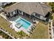 Aerial shot of a modern backyard pool and hot tub with lounge area and tiled patio at 1549 Casita Ln., Myrtle Beach, SC 29579