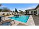 Stunning backyard pool and spa area with travertine tile decking, perfect for relaxation and entertaining at 1549 Casita Ln., Myrtle Beach, SC 29579