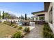 Landscaped backyard boasts a swimming pool, spa, outdoor kitchen, and patio area for dining at 1549 Casita Ln., Myrtle Beach, SC 29579