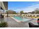 Backyard includes a swimming pool, outdoor seating, and a built-in grill for outdoor entertaining at 1549 Casita Ln., Myrtle Beach, SC 29579