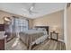 Bedroom with wood-look flooring, a ceiling fan, a window, and neutral-toned walls, offering a calm, relaxing atmosphere at 171 Talon Dr., Conway, SC 29527