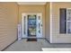 Inviting front porch with a decorative welcome sign and a storm door entry for added security and curb appeal at 171 Talon Dr., Conway, SC 29527