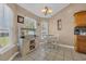 Bright kitchen nook with tile floors, a charming table and chairs set, and windows that bring in natural light at 171 Talon Dr., Conway, SC 29527
