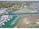 Aerial shot showcasing a vibrant waterfront area with boats and stunning waterways at 174 Sea Shell Dr. # 19, Murrells Inlet, SC 29576