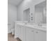 Bathroom featuring double sinks, a granite countertop, and neutral tile flooring at 174 Sea Shell Dr. # 19, Murrells Inlet, SC 29576