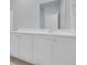 Bright bathroom featuring a white vanity with cabinet storage and a large mirror at 174 Sea Shell Dr. # 19, Murrells Inlet, SC 29576