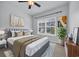 Bedroom filled with natural light, neutral color palette, and ceiling fan at 174 Sea Shell Dr. # 19, Murrells Inlet, SC 29576