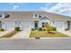 Charming townhome featuring an attached garage and a well-manicured lawn at 174 Sea Shell Dr. # 19, Murrells Inlet, SC 29576