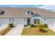 Charming townhome featuring a teal door, attached garage, and lovely landscaping at 174 Sea Shell Dr. # 19, Murrells Inlet, SC 29576