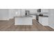 Bright and airy kitchen with granite countertops, stainless steel appliances, and white cabinetry at 174 Sea Shell Dr. # 19, Murrells Inlet, SC 29576