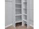 Custom walk-in closet design featuring white shelving units and a hanging rod for optimal storage at 174 Sea Shell Dr. # 19, Murrells Inlet, SC 29576