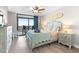 Serene bedroom featuring beach-inspired decor, balcony access, and comfortable furnishings at 201 74Th Ave. N # 1802, Myrtle Beach, SC 29572