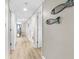Hallway features decorative fish art, leading to bright living area with outside views at 201 74Th Ave. N # 1802, Myrtle Beach, SC 29572
