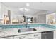 Updated kitchen featuring granite countertops, stainless appliances and seamless view into living area at 201 74Th Ave. N # 1802, Myrtle Beach, SC 29572