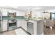 Charming kitchen with stainless steel appliances, subway tile backsplash, and open concept living space at 201 74Th Ave. N # 1802, Myrtle Beach, SC 29572
