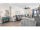 Cozy living room decorated with nautical accents, comfortable sofas, and a ceiling fan at 201 74Th Ave. N # 1802, Myrtle Beach, SC 29572