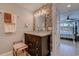 Bathroom featuring a dark vanity with marble countertop, decorative lighting and backsplash at 2180 Waterview Dr. # 513, North Myrtle Beach, SC 29582