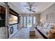 Inviting living room featuring a ceiling fan, built-in shelving, a comfortable sofa, and sliding glass doors to the exterior at 2180 Waterview Dr. # 513, North Myrtle Beach, SC 29582
