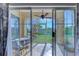 Relaxing screened porch featuring tile flooring, fan, patio furniture and stunning views of the water at 2180 Waterview Dr. # 513, North Myrtle Beach, SC 29582