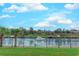 Tranquil water view from the property, enhanced by lush greenery, mature trees, and a secure fence line at 2180 Waterview Dr. # 513, North Myrtle Beach, SC 29582