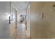 Hallway leading to the living room with tile flooring and views of the seating and ocean at 2301 S Ocean Blvd. # 1023, Myrtle Beach, SC 29577