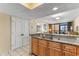 Condo kitchen features granite countertops and stainless steel sink with view of the ocean at 2301 S Ocean Blvd. # 1023, Myrtle Beach, SC 29577