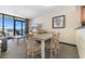 Living area with dining, seating, tv and balcony access with an ocean view at 2301 S Ocean Blvd. # 1023, Myrtle Beach, SC 29577
