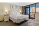 This main bedroom features balcony access and ample space for rest and relaxation at 2301 S Ocean Blvd. # 1023, Myrtle Beach, SC 29577