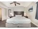 Comfortable bedroom features a ceiling fan, nightstands, lamps, closet, and a decorative mirror at 2600 N Ocean Blvd. # 1914, Myrtle Beach, SC 29577