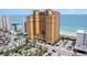 Aerial view of yellow oceanfront condo building, beach, and golf course at 2600 N Ocean Blvd. # 1914, Myrtle Beach, SC 29577