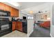 Well-equipped kitchen with a bar overlooking the living room and ocean-view balcony at 2600 N Ocean Blvd. # 1914, Myrtle Beach, SC 29577