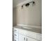 Bathroom vanity with quartz countertop and modern light fixture at 2921 Hughes Gasque Rd., Aynor, SC 29511