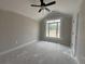 Bright bedroom features a large window with high vaulted ceiling, creating a serene retreat at 2921 Hughes Gasque Rd., Aynor, SC 29511