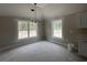 Bright dining area with windows offering great natural light, complemented by stylish chandelier at 2921 Hughes Gasque Rd., Aynor, SC 29511