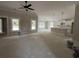 Well-lit living room with a ceiling fan and an open view into the adjacent kitchen area, great for modern living at 2921 Hughes Gasque Rd., Aynor, SC 29511