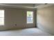Unfinished bedroom offering natural light from two large windows at 2925 Hughes Gasque Rd., Aynor, SC 29511