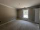 Cozy bedroom with neutral walls and a large window, perfect for creating a comfortable space at 2925 Hughes Gasque Rd., Aynor, SC 29511