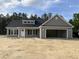 Beautiful single-story home with gray siding, black shutters, and an attached two-car garage at 2925 Hughes Gasque Rd., Aynor, SC 29511